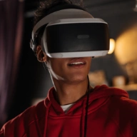 boy wearing virtual reality glasses to study